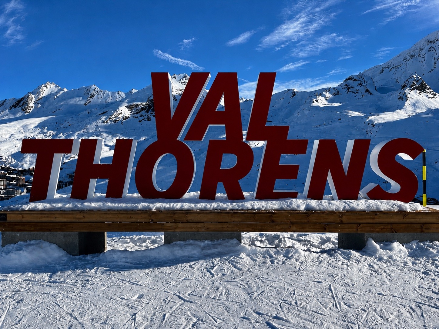 Val Thorens resort sign in front of the snow-covered mountains
